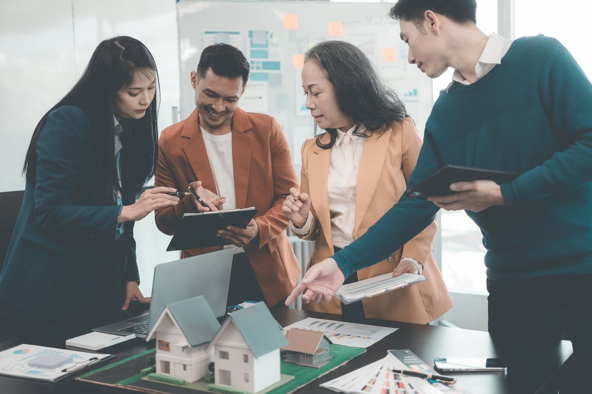 Home development concept, smart home, home automation system mockup with business people on blurred background in building design studio, architecture real estate project concept