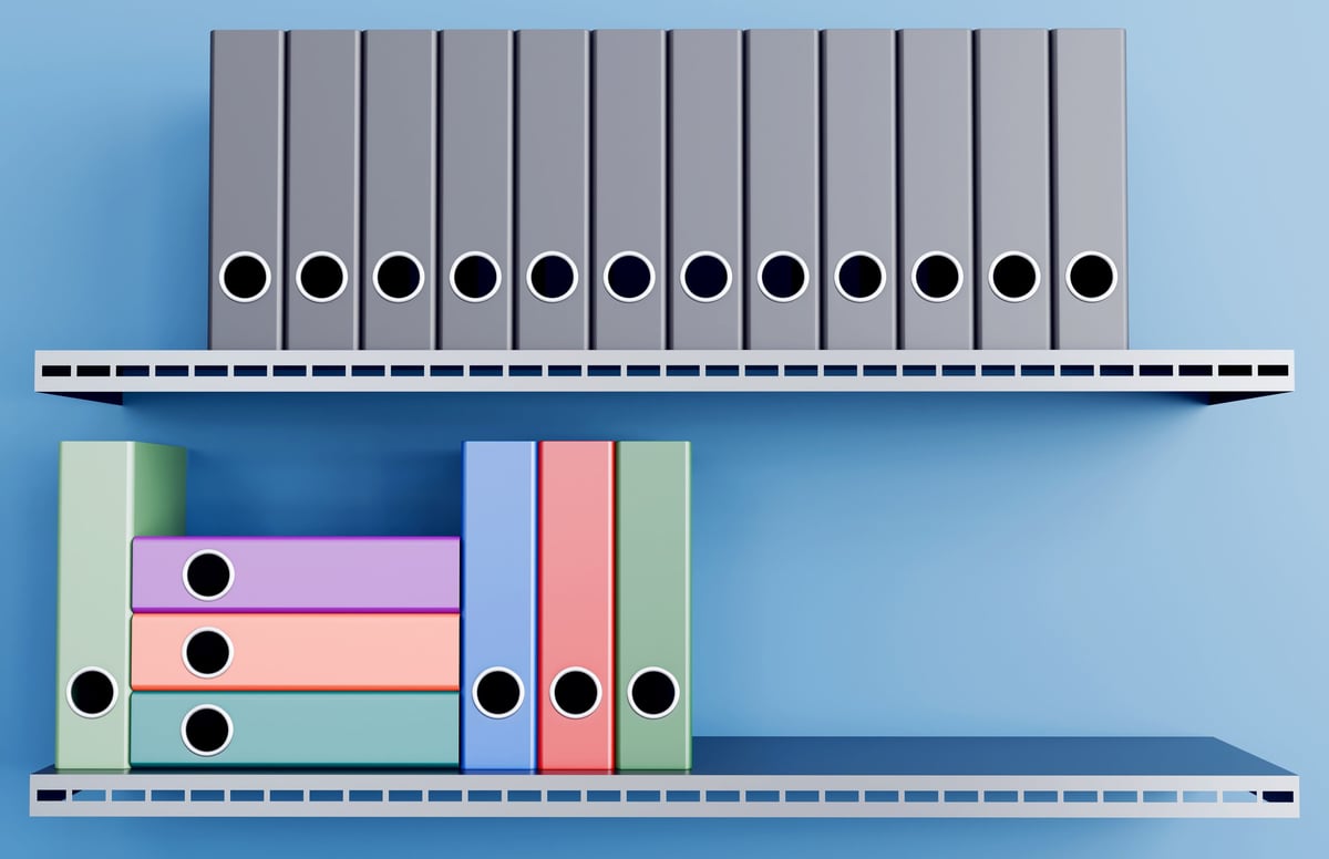 File folders arranged on shelf in row