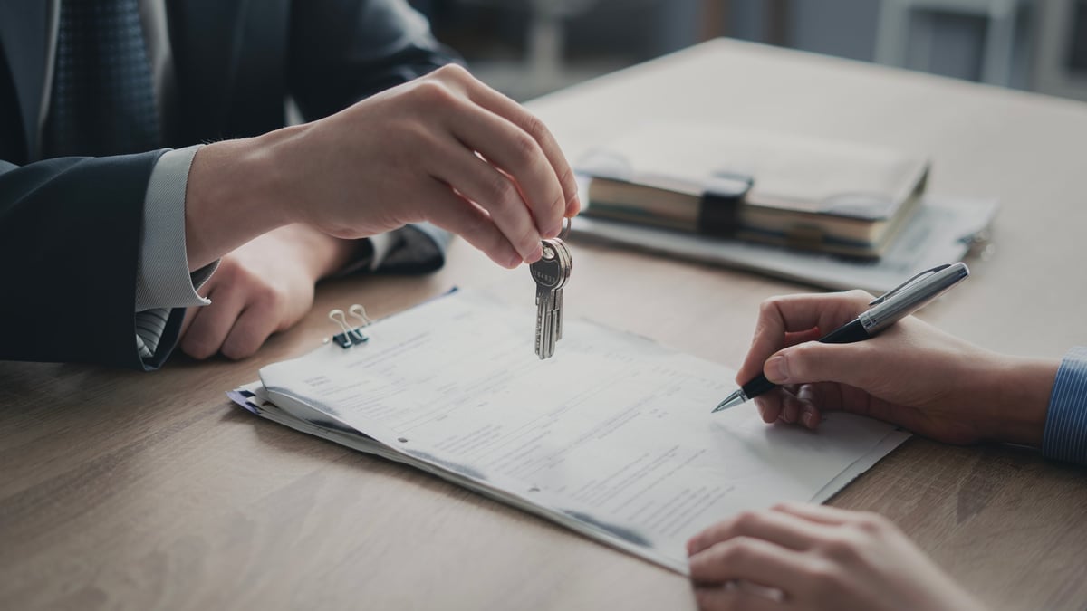 Signing the document and receiving the keys
