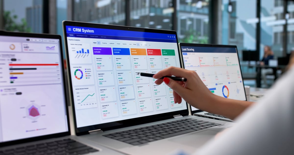 Woman Analyzes Sales Data On Laptop To Improve Customer Engagement Workflow.