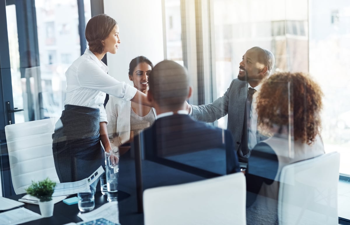 Shot of a team of professionals having a meeting in the boardroom at work